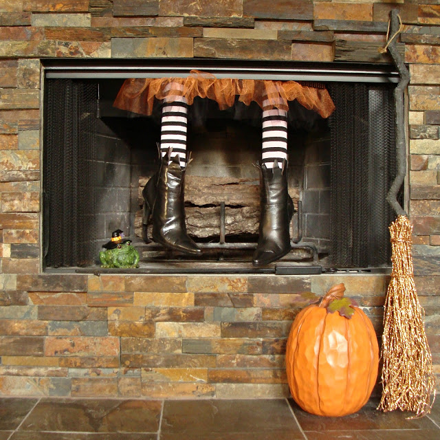 A pair of which legs dangling down the chimney