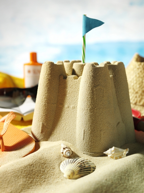 sandcastle with popsicles beach activities