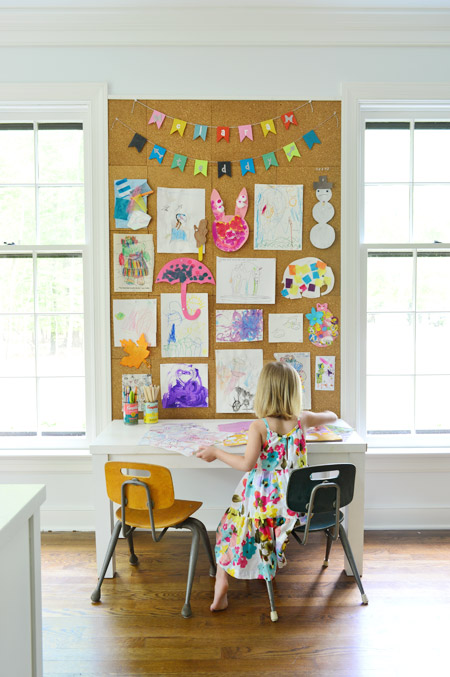 DIY child artwork display on corkboard