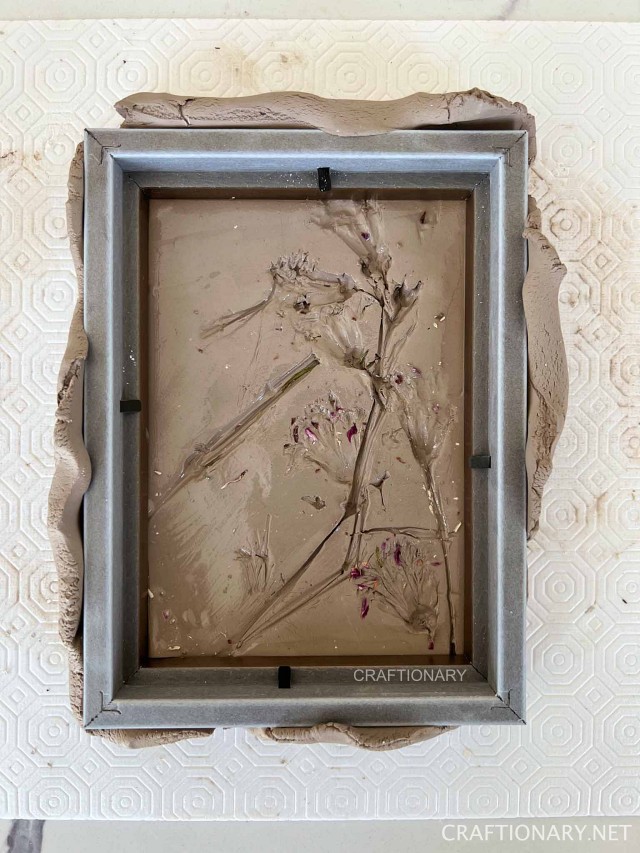 bas-relief mold for dried botanicals art with modelling clay and frame