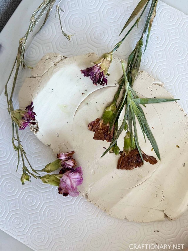 embed dried flowers in clay for custom prints casting art