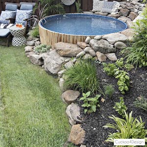 stock-tank-swimming-pool-in-sloped-yard-with-pool-liner_8412