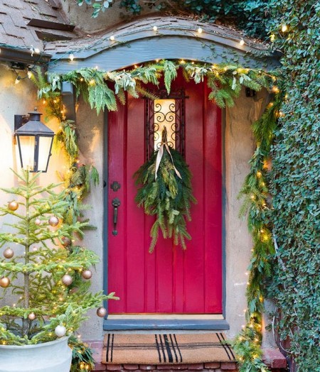 greenery-and-lights-christmas-door-decor