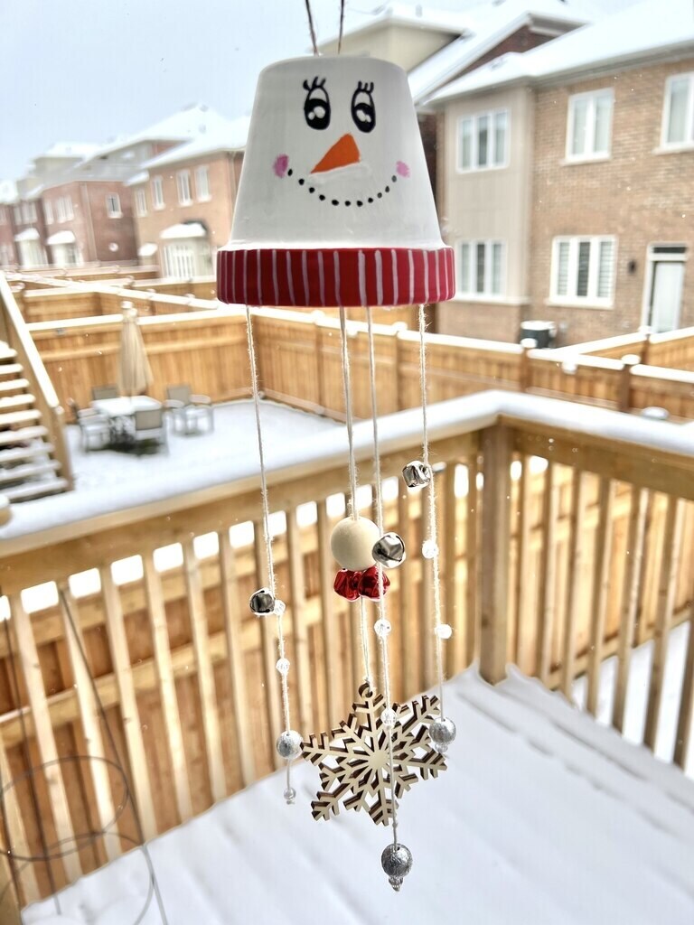 winter-craft-snowman-wind-chime-in-the-snow-chiming