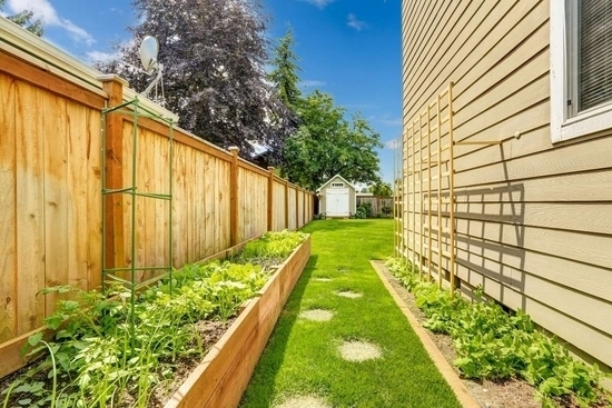 raised-bed-against-a-fence