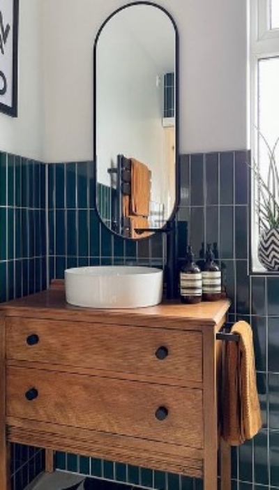 Turn a vintage cabinet into bathroom vanity and add a side railing for hanging towel.