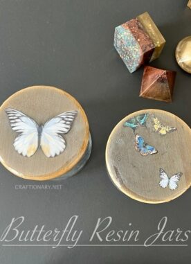 Unique butterfly epoxy resin art on bamboo jars