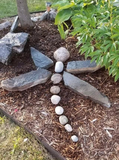 gluing rocks together - Google Search  Rock sculpture, River rock crafts,  Garden rock art