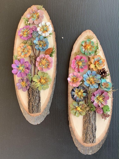 painted-pinecones-on-wooden-boards