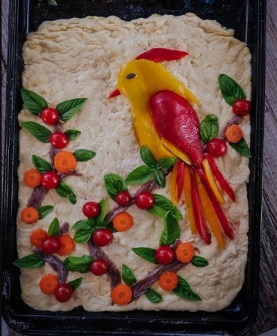 Bird on branches bread art with carrots
