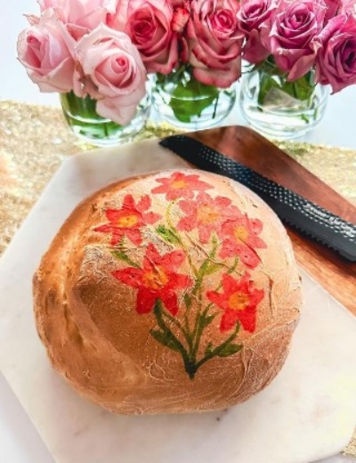 Painting flowers on sourdough bread