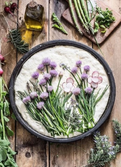 Purple edible flower bread art with asparagus