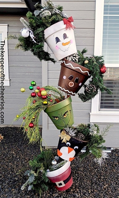 stacked-pots-christmas-decoration-snowman-gingerbread-man-grinch-penguin-santa
