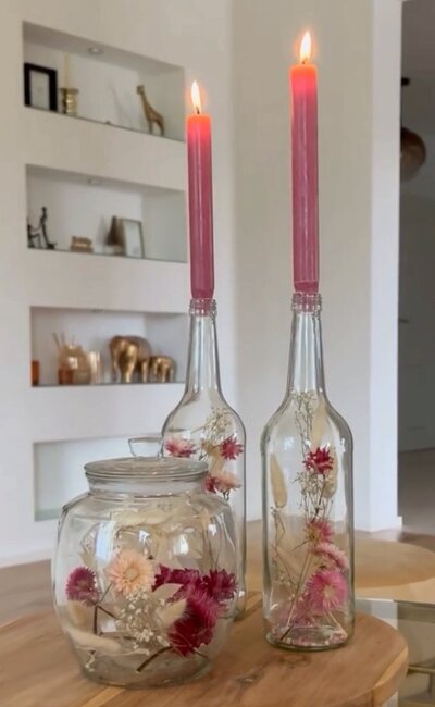 Candle-Holder-with-Narrow-Wine-Bottles-and-Flowers