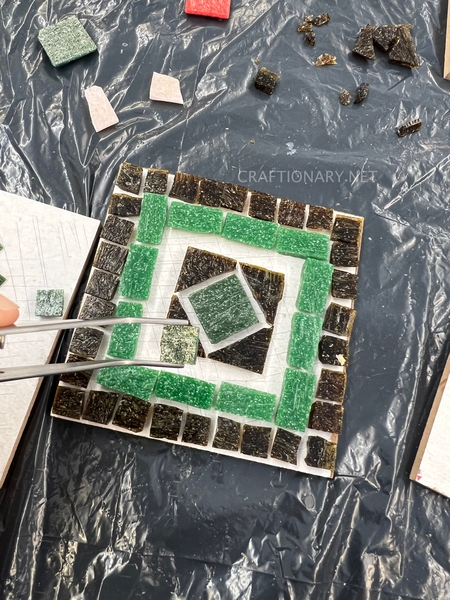 use-tweezer-to-place-glass-tiles-mosaic