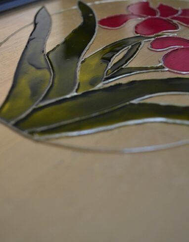 Gilding glass with gold leaf sheets