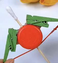 Crafts-Zone-bottle-cap-bow-and-arrow