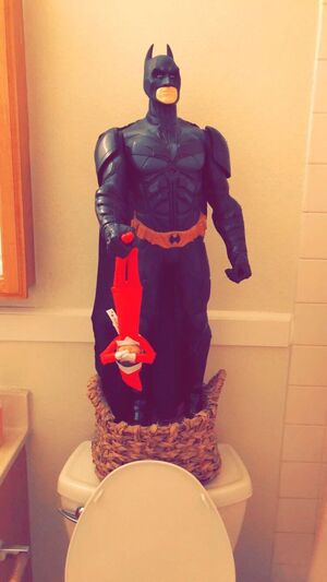 Batman-Dangling-Elf-over-the-Toilet