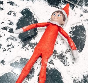 Elf-Making-a-Snow-Angel-with-flour
