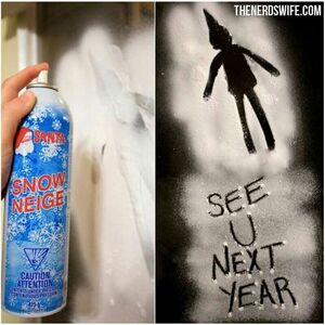 Elf-on-the-Shelf-Goodbye-with-snow-sprayed-message-on-the-window