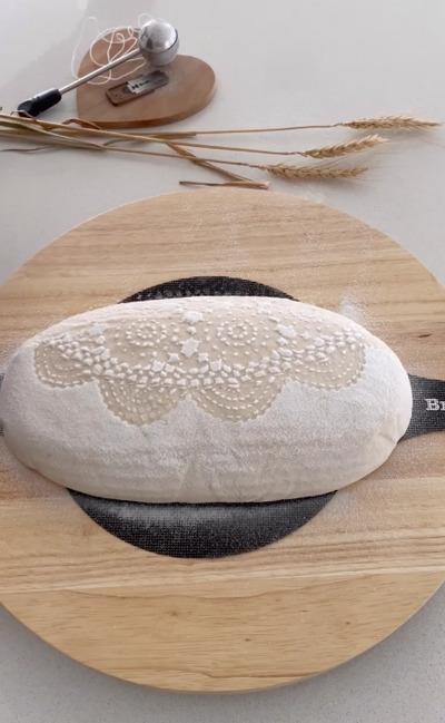 Crochet-Doily-Used-as- Bread-Decorating-Stencil