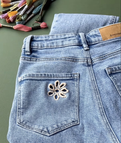 A-denim-kari-flower-embroidery-pattern-is-used-to-thrift-an-old-pair-of-jeans