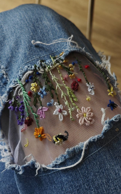 Embroidery-on-net-overlays-stitched-to-denim