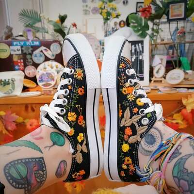 Scattered-Orange-and-Yellow-Florals-hand-embroidered-on-Black-Sneakers