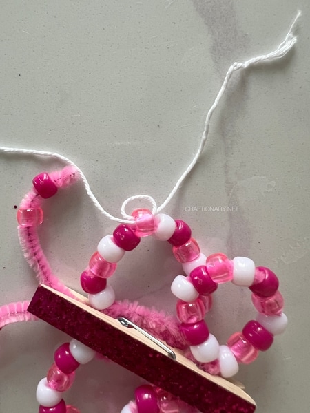 loop-string-to-hang-beaded-butterflies-diy