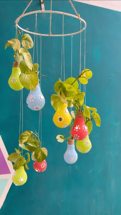 make-a-water-plant-displaying-chandelier-with-old-bulbs-and-embroidery-hoops