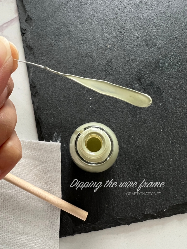 dipping-the-wire-frame-in-paint